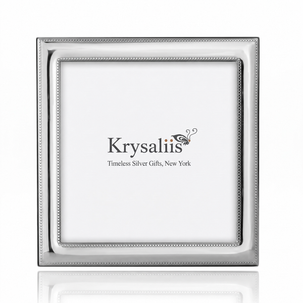 A square silver picture frame with a beaded inner border, shown empty against a white background with a faint reflection below. The brand name 'Krysaliis' is printed in the center of the insert.